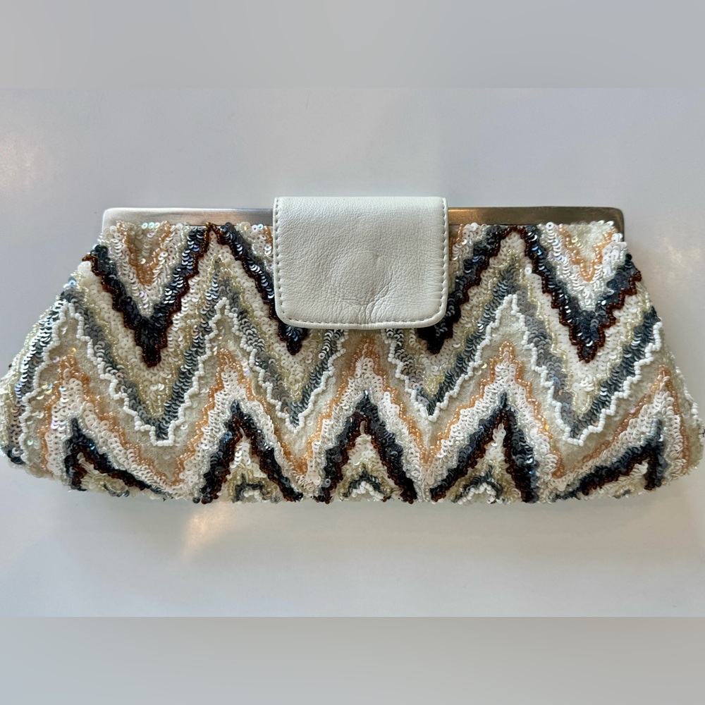 Never used with Neiman Marcus price tag attached Santi sequin clutch cream, blue